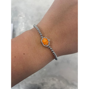 KENDRA SCOTT PUMPKIN STRETCH BRACELET SILVER ORANGE MOTHER OF PEARL