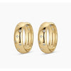 Pair of gold hoop earrings with embedded diamonds on a white background