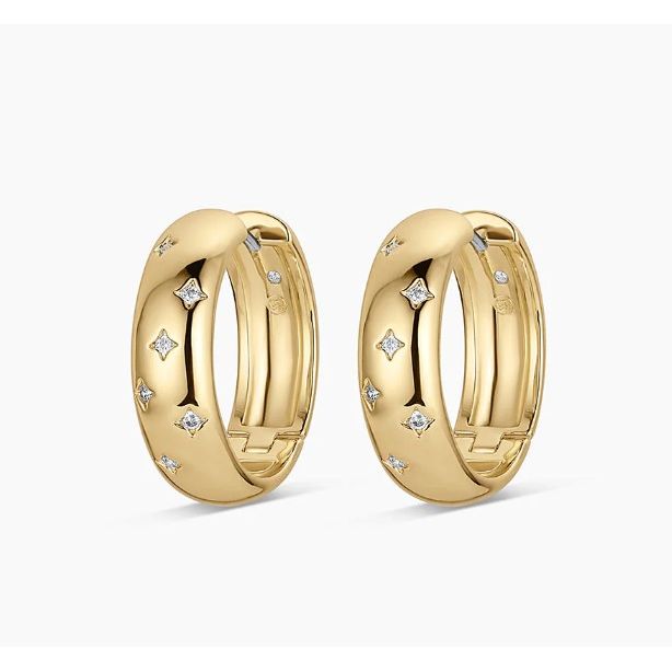 Pair of gold hoop earrings with embedded diamonds on a white background