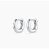 Pair of silver hoop earrings on a white background