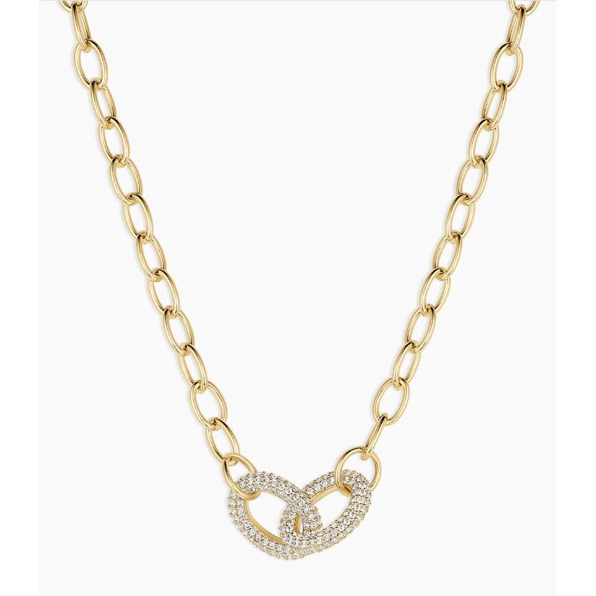 Gold chain necklace with a heart-shaped clasp on a white background