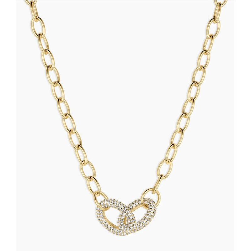 Gold chain necklace with a heart-shaped clasp on a white background