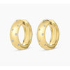 Gold hoop earrings with embedded diamonds on a white background