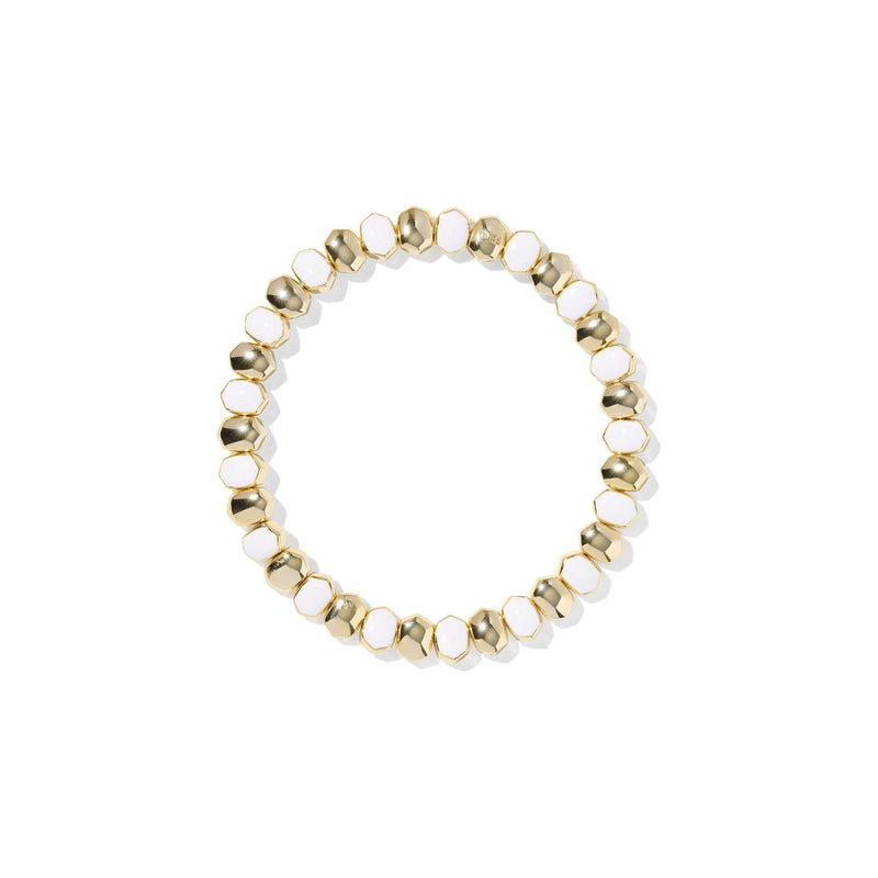 Bracelet with gold and white beads on a white background