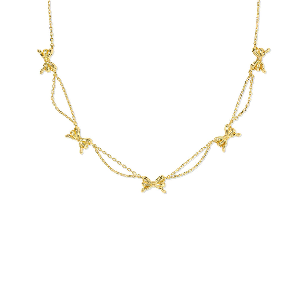 Gold necklace with bow-shaped pendants on a white background