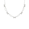 Silver necklace with bow-shaped pendants on a white background
