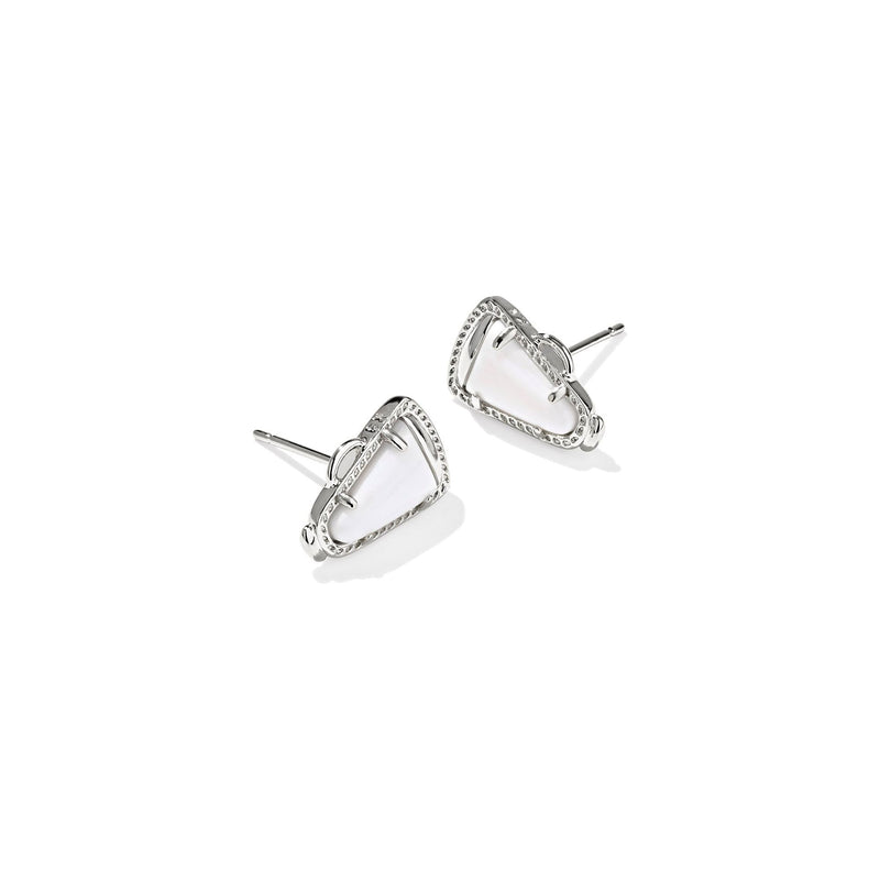 Pair of silver earrings with clear gemstones on a white background