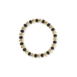 Gold and black beaded bracelet on a white background