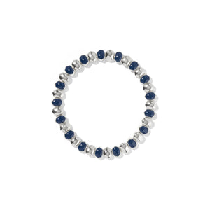 Silver bracelet with blue beads on a white background