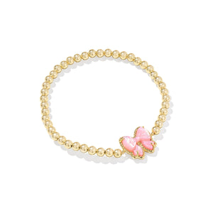 Bracelet with pink bow charm on a white background